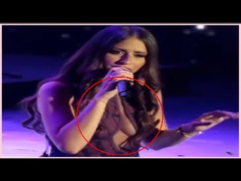 لايف ستايلشاهد: فستان جريء يضع فنانة لبنانية في موقف محرج على المسرح57997/0