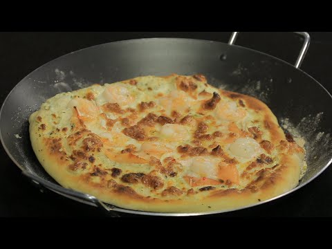 بالفيديو طريقة عمل بيتزا السي فود بصوص ابيض