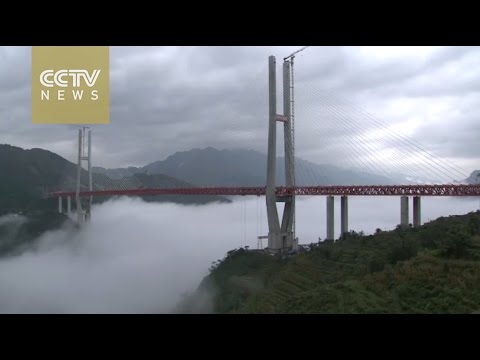 لمسات البناء الأخيرة لأعلى جسر في العالم